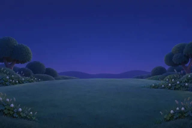 Round trees and white clover flowers on a soft rolling meadow at dusk.